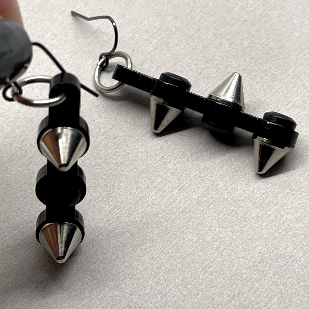 Punk goth stud earrings. Black metal with silver spike studs.